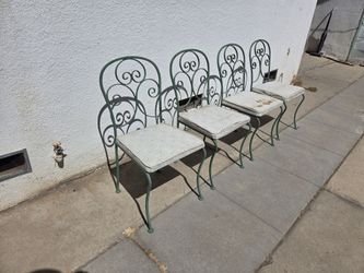 Mid-20th-century wrought iron patio dining chairs