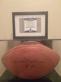Authentic hand signed one of a kind Dick butkus football in mirrored display case with certificate of authenticity