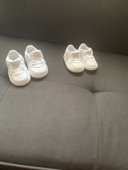 Two pair of white air forces