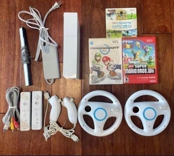 NINTENDO WII + 5 GAMES and 2 REMOTES + 2 STEERING WHEELS
