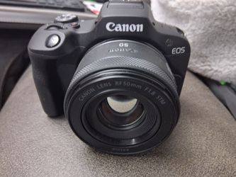 CANON EOS 100 + 2 LENSES, BATTERY AND CHARGER & TRI-POD