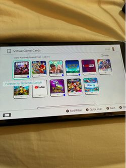 Nintendo Switch with digital game library including Mario Kart 8 Deluxe, Pokémon Violet, Fire Emblem Engage, Nintendo Switch Sports, Stardew Valley, O