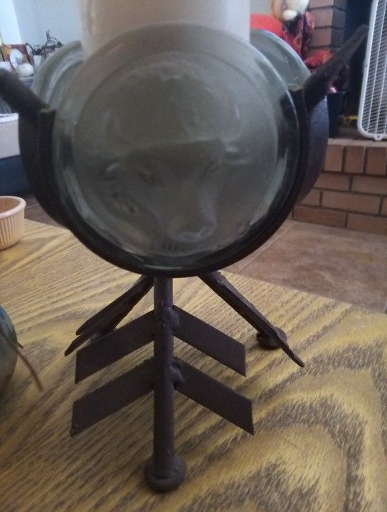 Wrought Iron Raised Buffalo Head and Arrow Candle Holder. The Buffalo Head Is On Frosted Glass