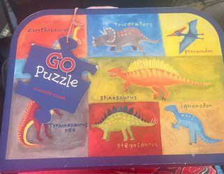 Dinosaur floor puzzle (36 pieces, ages 3-6) with carrying case. Crocodile Creek brand.