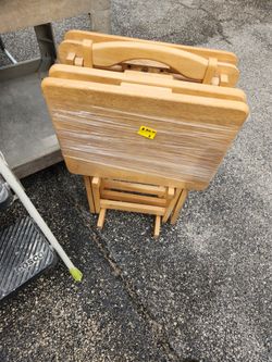 USED NATURAL WOOD 4 PC TRAY TABLES AND STAND