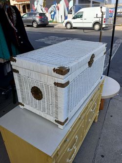 white wicker storage trunk