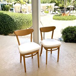 Pair of authentic thonet bistro chairs with sunbrella cushions. Price is for the pair.