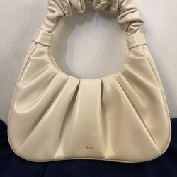 JW PEI white designer hand bag scrunched.