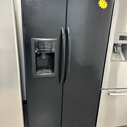 Side By Side Black GE Refrigerator 