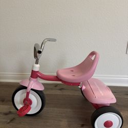 Pink Radio Flyer tricycle