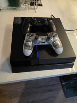 PS4 with Controllers and Games