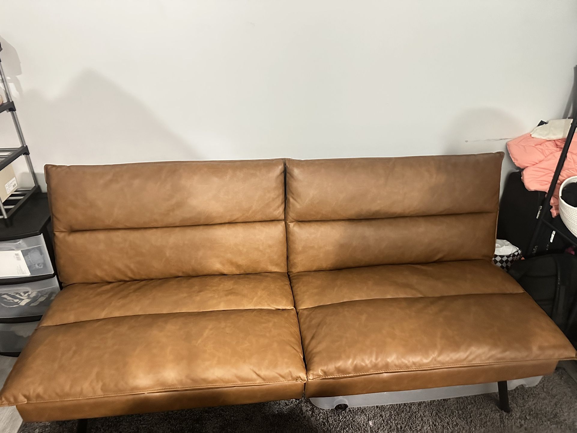 Fold out brown leather futon
