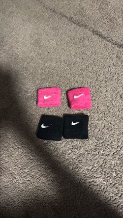 Pink and black Nike armbands