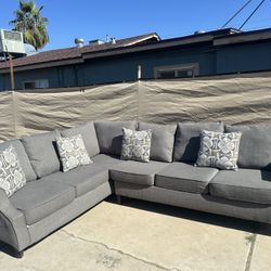 Gray Sectional.   $430 Delivered Available Small Fee   91”x 122”