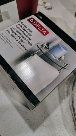 Delta glass corner shelf with towel bar