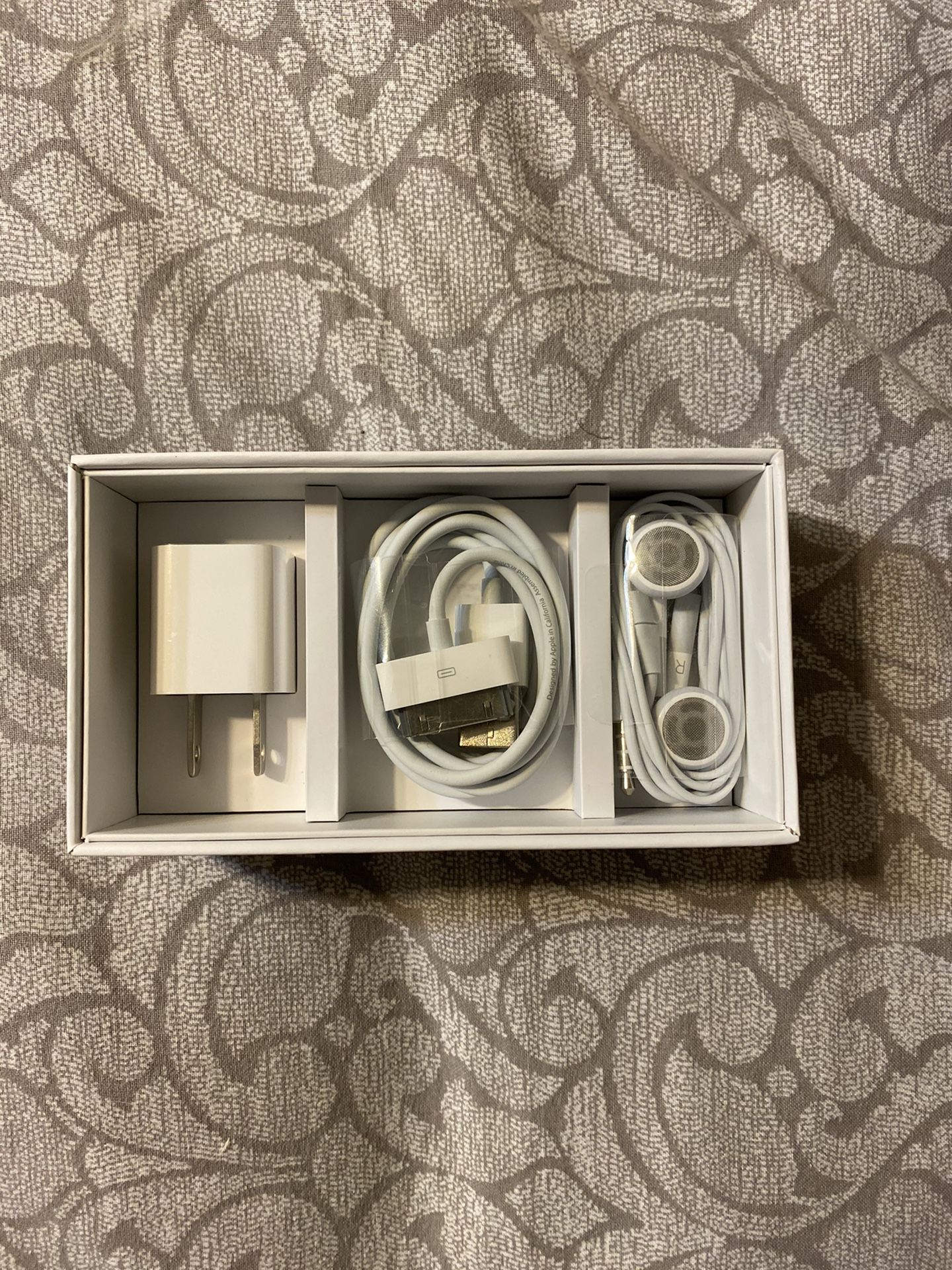 Genuine I-phone 4 accessories. Earphones with Remote and Mic; Dock Connector to USB Cable; and USB Power Adapter. Supports UMTS/HSDPA/HSUPA (850/900/1