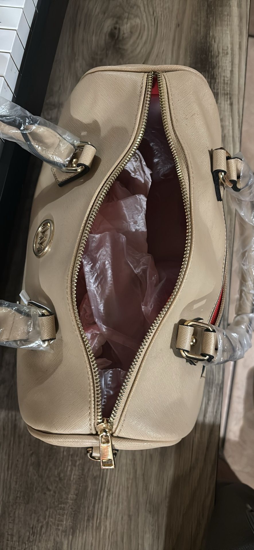 This item is a Marilyn Monroe handbag in a cream color