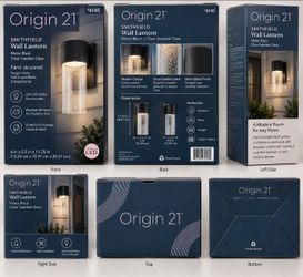 Brand new Smithfield Wall Lantern by Origin 21. Matte black finish with clear seeded glass. Modern design, perfect for outdoor use, entryways, patios,