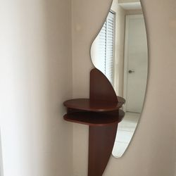 New   Luxury Italian entrance console table with mirror. Mirror has a custom shape. Solid wood table color: Brown Cherry. H80”X W26”. Made In Italy .