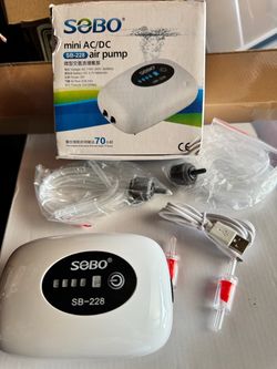 Mini ac/dc air pump rechargeable with charge cable, air lines and valves as pictured for aquarium tanks
