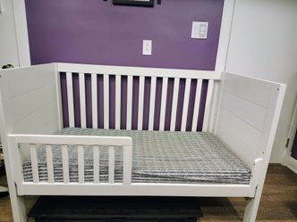 3 in 1 convertible crib with infant/toddler mattress and sheets.