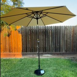10 ft. Iron Crank Lift Market Solar Panel Powered LED Light Tilt Patio Umbrella in Tan