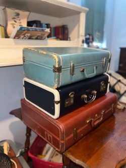 3 vintage suitcases