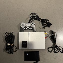 PlayStation 2 Slim  Silver Bundle - loaded with games