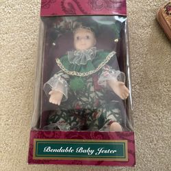 Jester and bear dolls in boxes