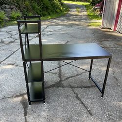Black office desk with three shelves