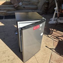 4.3 cu ft Mini Refrigerator Stainless Steel.  This is larger  than the other sizes. It 32"t x 20 w x 21D