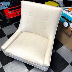 White padded chair with wooden legs for home or office. Retails $115.