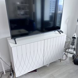 TV and TV stand with custom cabinet doors and legs