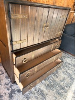 vintage Furniture dresser featuring wood construction with brass hardware accents