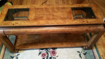 This vintage Chinoiserie style console table features high-quality oak and burl wood construction with beveled glass top inserts.