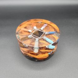 Seven Chakra HandMade Orgonite, With Tiger Eye Crystal Pyramid. 
Weighs 15.6 oz
1-3/4" H
Diameter is 3-3/4"
Copper wiring

Selenite  and Assorted  Cry