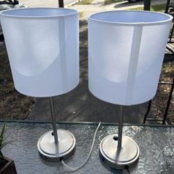 Two Metal Lamps With White Shades