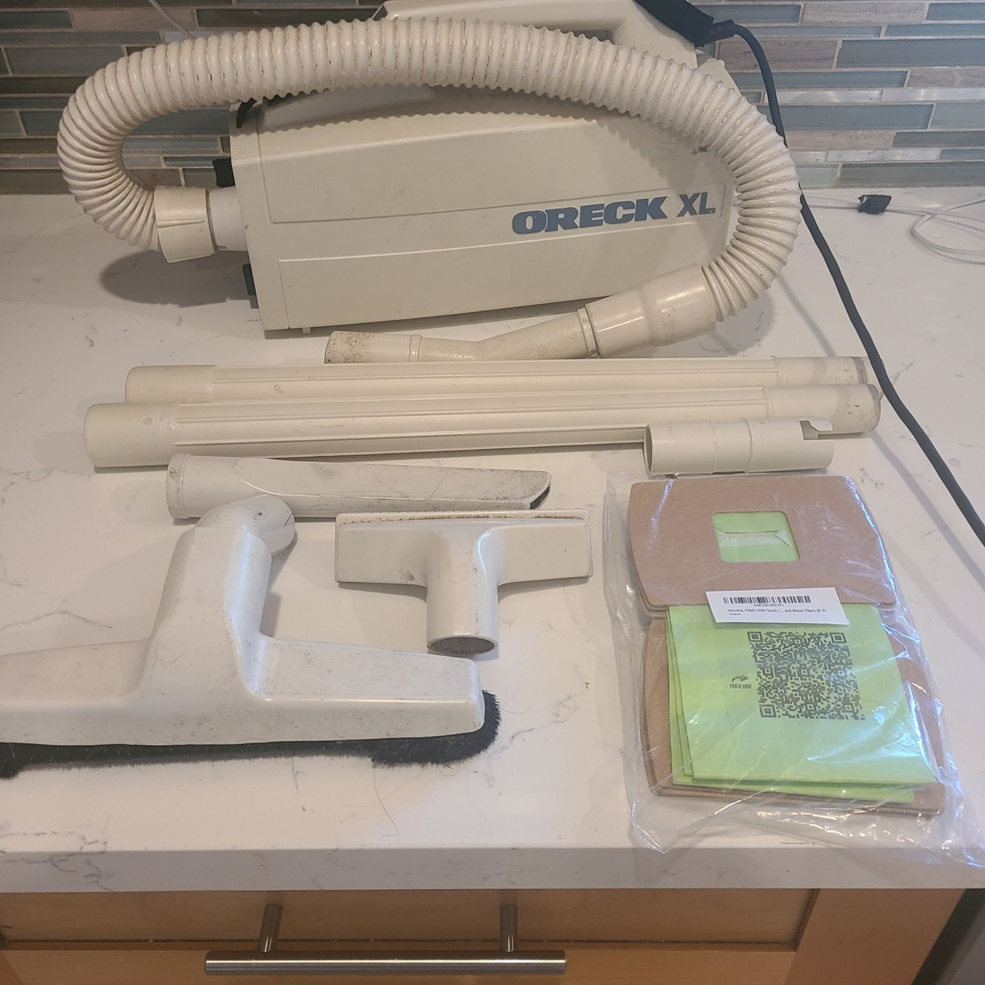 Oreck XL handheld vacuum with attachments and bags