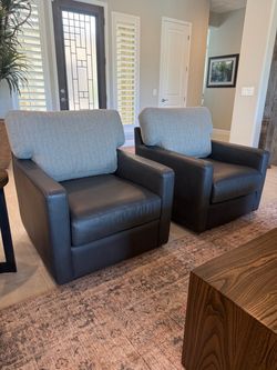 Creative Leather Accent Arm Swivel Chairs (2) $900 EACH