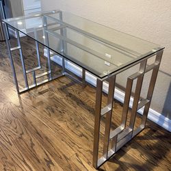 Modern, sleek glass and metal desk