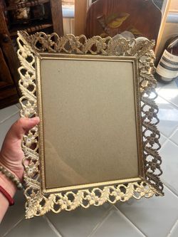 Vintage style metal frame with gold toned filigree border