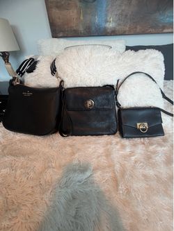 Three black hand bags shoulder