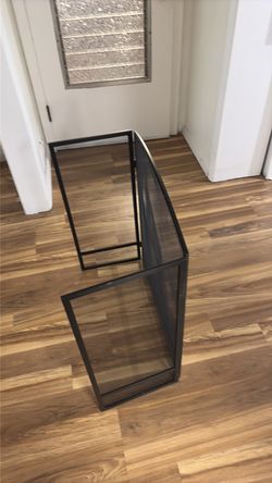 Screens of 3 panels in arch with double bar for fireplace.