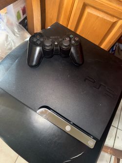 PS3 with controller and 5 games