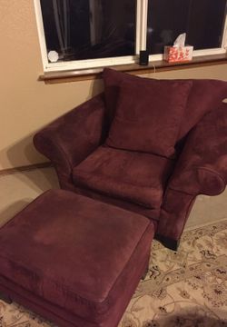 Red suede chair, pillow and ottoman