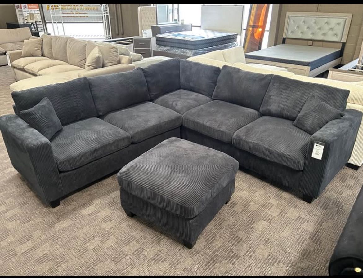 Black L  Shaped Sectional And Ottoman 