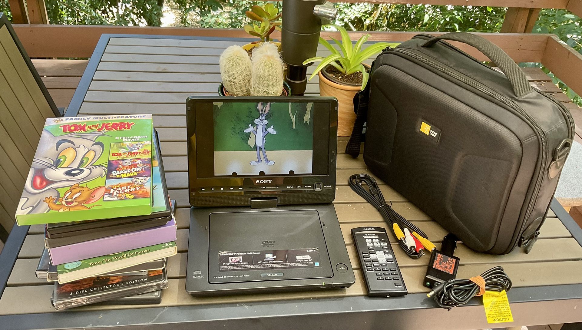Sony Portable DVd Player w/ Case & Accesories + DVDs (Northridge)