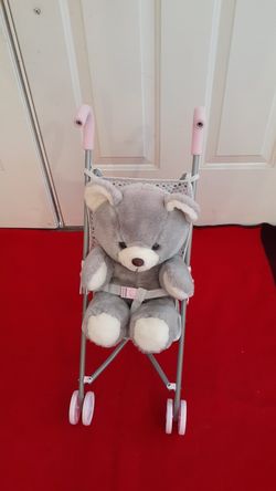 Teddy bear with stroler. Toy