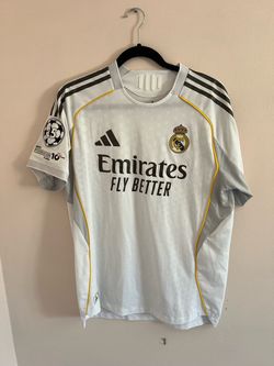 Authentic white Real Madrid jersey.