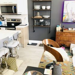 Pair of mid century modern swivel chairs